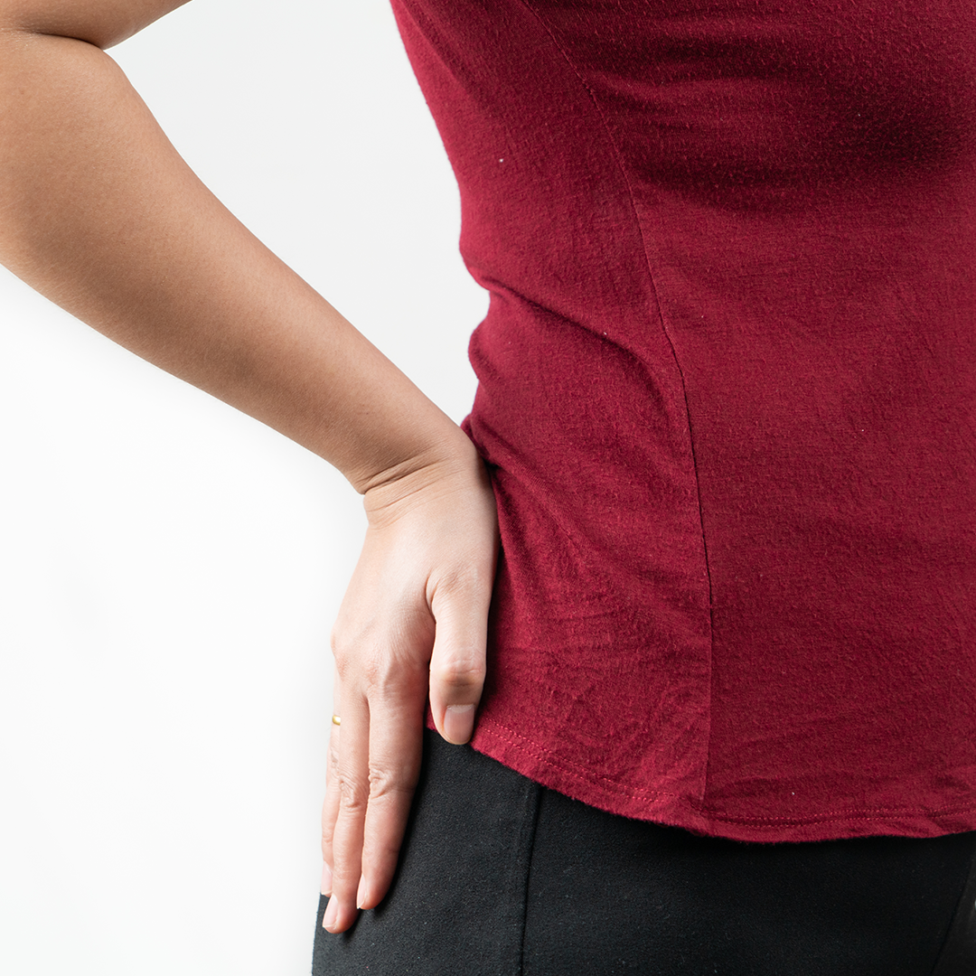 woman holding her hip due to pain